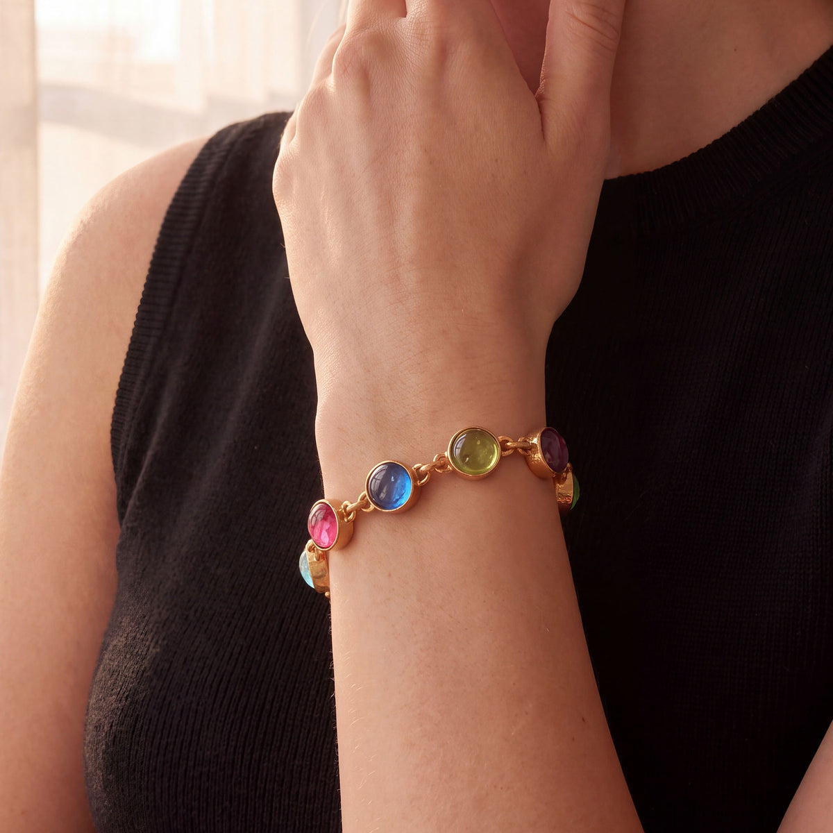 Elizabeth Locke pastel Venetian glass intaglio bracelet in 19K yellow gold shown on the wrist.