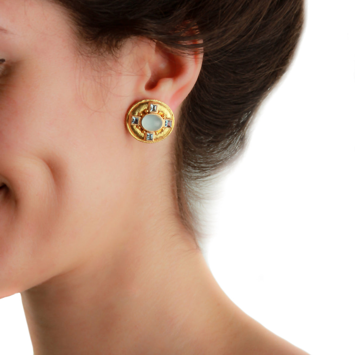 Elizabeth Locke aquamarine and hammered yellow gold earring worn on the ear, showing its size and fit.