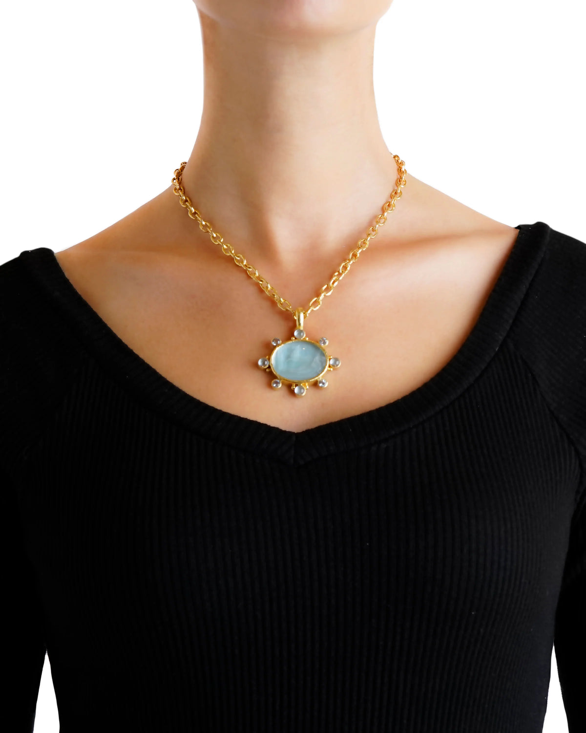 Elizabeth Locke light aqua intaglio and aquamarine pendant worn on a yellow gold link chain, showing its size and placement.