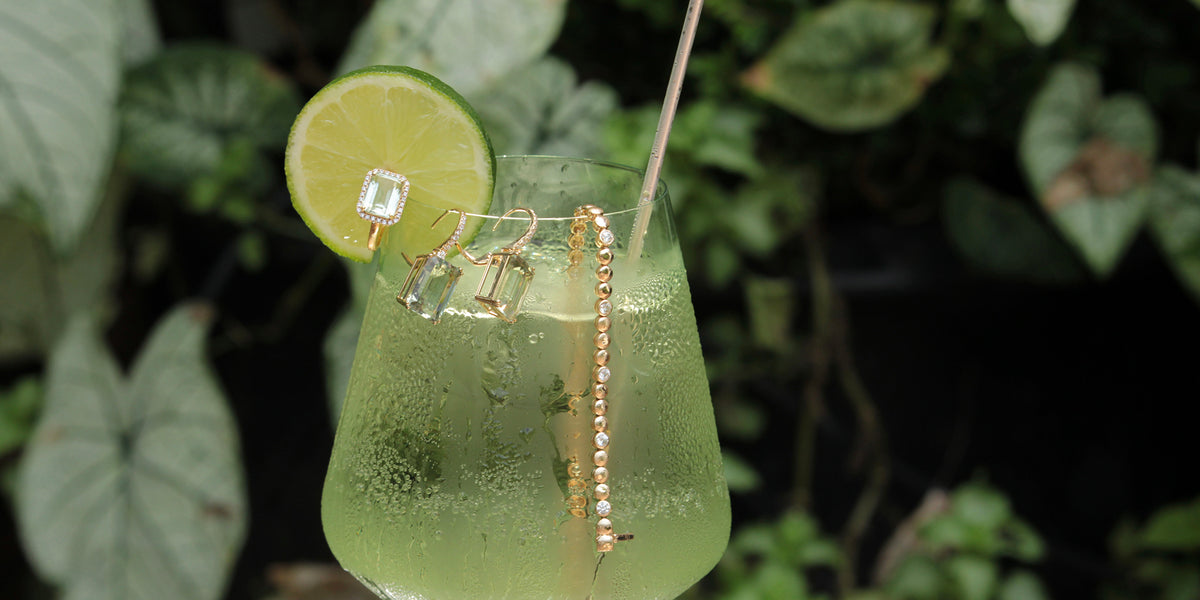 Jewelry styled for golden hour with a Hugo Spritz — Croghan's Jewel Box, fine jewelers since 1907