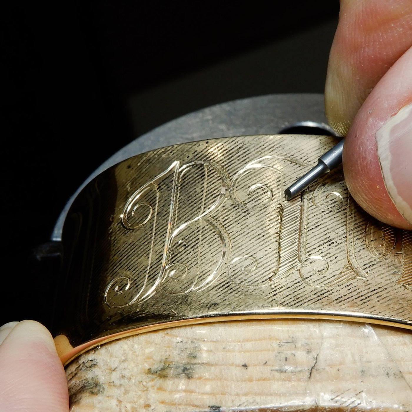 exclusive extra wide cuff being hand engraved